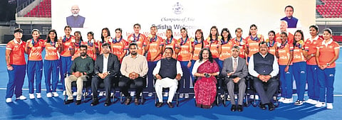 Chief Minister Mohan Charan Majhi posing for a group photo with women’s hockey team at Kalinga Stadium in Bhubaneswar on Friday