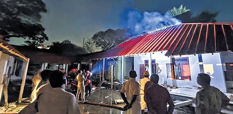 Fire and Rescue Services officials trying to put out the fire that broke out at Cantonment House on Saturday