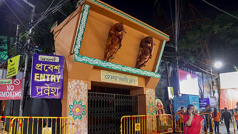 View of the closed entry gate barricaded by police following a stampede-like situation at another venue in the city, at Chetla Agrani Durga Puja pandal, in Kolkata, Saturday, Oct. 17, 2026