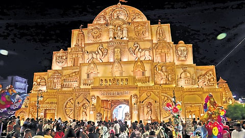 Devotees gather in front of the Saheed Nagar Durga Puja pandal for darshan of Goddess Durga, in Bhubaneswar on Saturday | Shamim Qureshy