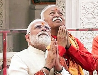In this photo from November 25, 2026, Prime Minister Narendra Modi and RSS Chief Mohan Bhagwat pray during the Dhwajarohan Utsav at Shri Ram Janmabhoomi Mandir in Ayodhya.