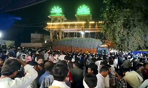 Police gather at the site after thirteen persons were killed and nearly 40 others suffered injuries when a truck crashed into several devotees waiting near a temple, in Madhya Pradesh's Gwalior city, Sunday, Oct. 18, 2026.