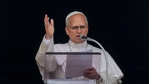 Pope Leo XIV appears at the window of his study in the Apostolic Palace overlooking St. Peter's Square at the Vatican for the traditional noon blessing after praying the Angelus, Sunday, Oct. 18, 2026, a day after he returned from the hospital, where he had lung cancer removed on Tuesday.