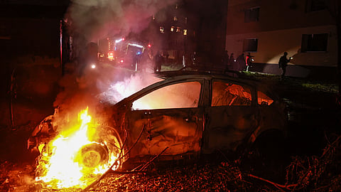 A car burns after a Russian airstrike on a residential neighborhood in Zaporizhzhia, Ukraine, Saturday, Oct. 17, 2026.