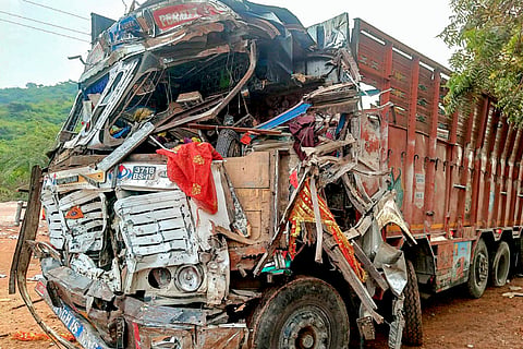 Wreckage of a truck after it ploughed into several devotees before crashing into a temple's entry gate, in Gwalior, Madhya Pradesh, Sunday, Oct. 18, 2026. Fourteen persons were killed, and at least 28 others suffered injuries in the incident.