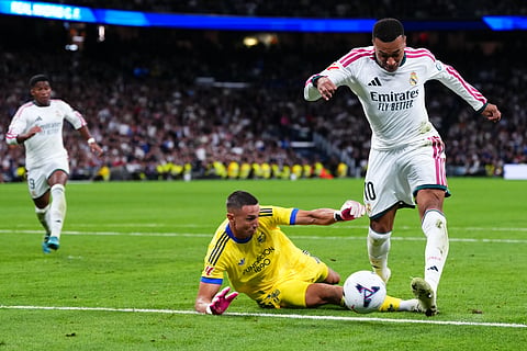 Real Madrid's Kylian Mbappe scores second goal during the La Liga soccer match between Real Madrid and Sevilla in Madrid, Spain, Sunday, Oct. 18, 2026.