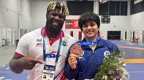 India's wrestling high performance director Ian Butler with his ward Komal after she won a bronze medal in the 59kg weight category at the U23 World Championships in Las Vegas, USA