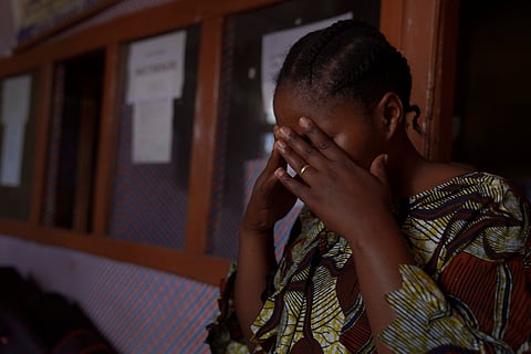 A woman reacts during an interview in Samelo psychotherapeutic health center where she receives mental health support after losing two family members and several close associates to Ebola virus, in Bunia, Congo, Oct. 15, 2026.
