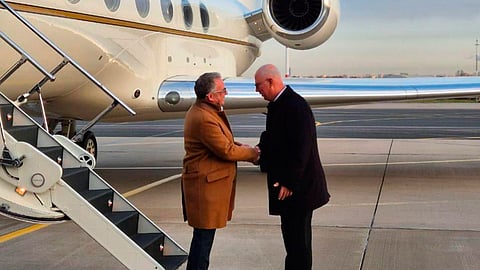 Russian presidential envoy Kirill Dmitriev, right, greets US special envoy Steve Witkoff at the international airport outside St. Petersburg, Russia, Wednesday, Oct. 21, 2026.