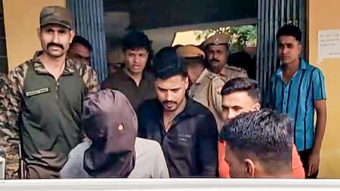 Three accused, including Ritik alias Roshan from Begusarai in Bihar and Rehan from Haryana's Sonipat, being brought out of Railway Colony Police Station after they were picked up from a train on Monday, a day after the firing at Bollywood actor Tiger Shroff's car in Mumbai's Juhu area, in Kota, Rajasthan, Tuesday, Oct. 20, 2026.
