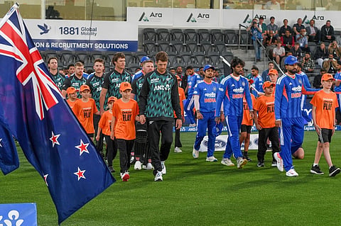 Mitchell Santner, left, of the Black Caps and Shreyas Iyer of India lead their teams onto the field for the T20 cricket international between India and New Zealand in Christchurch, New Zealand, Thursday, Oct. 22, 2026.