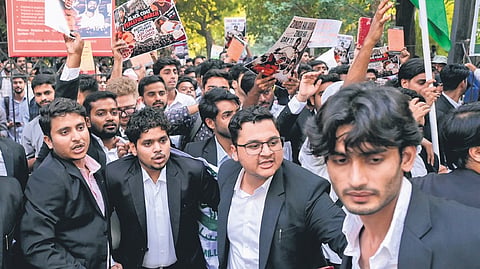 Law students of Jamia Millia take out a march at the campus on Thursday