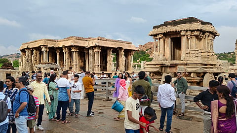 Large number of crowd gathered at noted Stone Chariot monument located in Hampi.