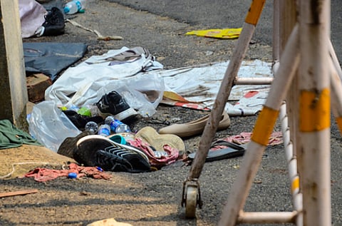 Kolkata: Shoes, clothing, and other belongings lie scattered near the entrance of the Chorbagan Sarbojanin Durga Puja pandal, a day after a stampede-like incident on Saptami evening left at least 19 people dead and 35 injured in Kolkata, West Bengal, on Sunday, October 18, 2026.