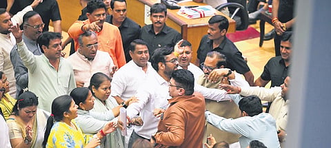 BJP & AAP councillors shout slogans during the meeting at the Civic Centre