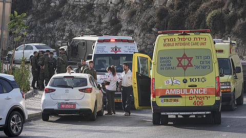 Israeli soldiers and emergency personnel gather near ambulances following a shooting attack near Yehuda Junction, near Hebron, in the occupied West Bank, Friday, Oct. 23, 2026.
