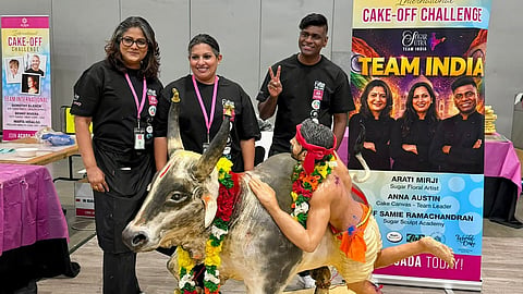 Arati Mirji, Anna Austin and Samie Ramachandran with their first-place-winning Jallikattu cake