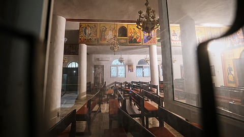 The interior of a Greek Orthodox church is seen hours after gunmen opened fire during a funeral in Hamoud village, in Jordan's Karak governorate, Friday, Oct. 23, 2026.