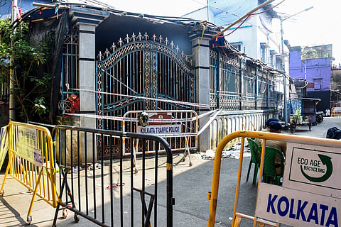 Security tightened outside the quadrant of the Chorbagan Durga Puja pandal stampede site, which claimed the lives of at least 19 people, in Kolkata, Oct. 19, 2026.