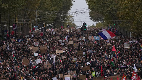 Protesters march during a demonstration against rising living costs in Paris, Saturday, Oct. 24, 2026.