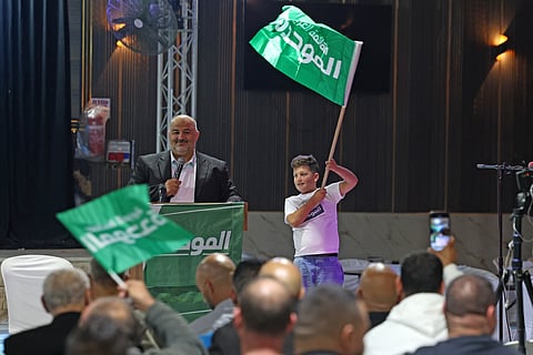 Mansour Abbas, head of Israel's conservative Islamic Raam party, speaks at a campaign rally in the Arab-Israeli village of Abu Gosh on October 21, 2026.
They will not govern Israel, but Arab-majority lists could be the kingmakers in close-fought elections just days away, guided by a voter base fed up with Prime Minister Benjamin Netanyahu.