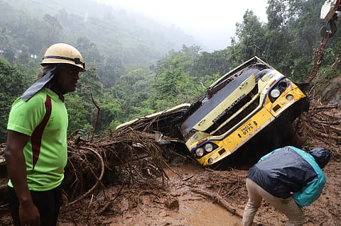 TNDRF personnel engaging in rescue operations to recover the bus caught in a landslide in Burliyar on Saturday