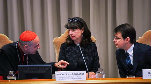 From left, Cardinal Víctor Manuel Fernández, prefect of the Dicastery for the Doctrine of the Faith, talks with theologian Anna Rowlands and Anthropic co-founder Christopher Olah during the presentation of Pope Leo XIV's first encyclical, "Magnifica humanitas: On Safeguarding the Human Person in the Time of Artificial Intelligence", at the Vatican, May 25, 2026.