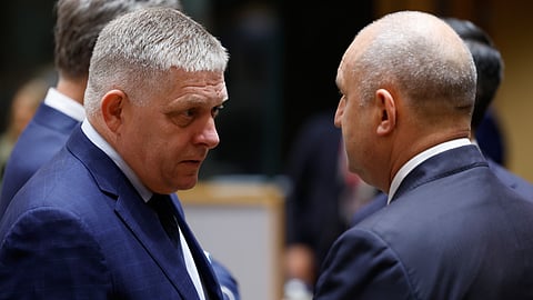 Slovakia's Prime Minister Robert Fico, left, speaks with Bulgaria's Prime Minister Rumen Radev during a round table meeting at the EU summit in Brussels, Friday, Oct. 16, 2026.