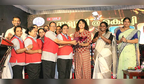 Samridhi staff along with Mayor V K Minimol handing over a memento to actor Rima Kallingal at a function celebrating five years of Samridhi@Kochi.