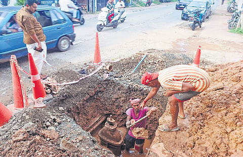 Workers engaged in repairing the burst pipeline near Bakery Junction