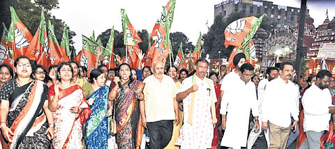 BJP leaders and workers during the protest march over the remarks of Congress president Mallikarjun Kharge against PM Narendra Modi, in Bhubaneswar
