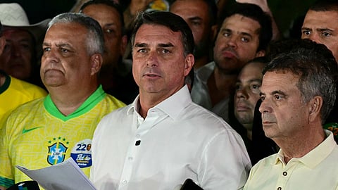 Brazil's right-wing senator and presidential candidate for the Liberal Party (PL) Flavio Bolsonaro reacts after knowing the first results in the presidential runoff election, in Brasilia, on October 25, 2026.