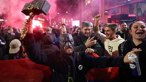 People celebrate after Aleksandar Vucic, leader of the right-wing Serbian Progressive Party (SNS) conceded defeat in the parliamentary election in Belgrade, Serbia, Sunday, Oct. 25, 2026.