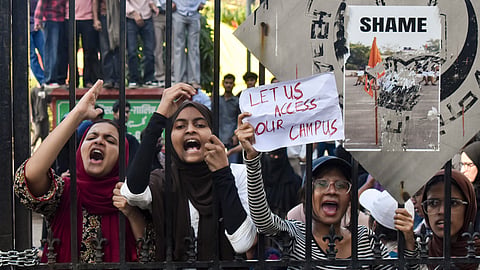 Students stage a demonstration outside Jamia Millia Islamia University in New Delhi on Monday, Oct. 26, 2026.