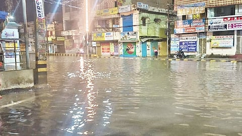 The flooded Gandhinagar main road in Berhampur on Tuesday evening.