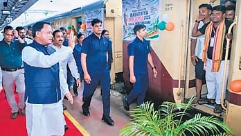CM Mohan Majhi waves at passengers as they set out for Gujarat to join the Nat’l Unity Day parade, in the special train