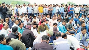 The workers staging a protest in front of Paradip Lock police station