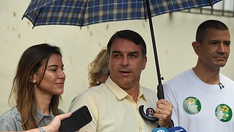 Opposition presidential candidate Sen. Flavio Bolsonaro speaks to journalists after voting in the presidential runoff in Rio de Janeiro, Sunday, Oct. 25, 2026.