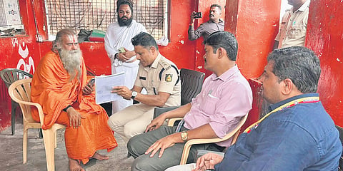 District and police officials on the Anjanadri Hill Hanuman Temple premises in Koppal
