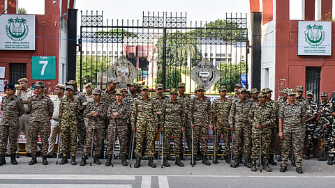 Security personnel stand guard outside Jamia Millia Islamia in New Delhi, Wednesday, Oct. 28, 2026.
