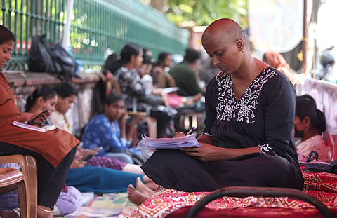 S Valarmathi secretary of All Kerala Lower Primary School Teacher (LPST) Rank Holders' Association, got her head shaved publicly and announced a fast unto death