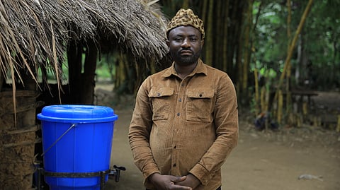 Mwami Alphonse Bin Kitobi, chief of the Bapakombe-Bakondo village, poses for a portrait in the Beni Territory of North Kivu, eastern Congo, Saturday, Oct. 24, 2026.
