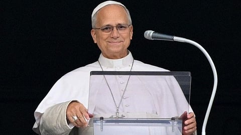 Pope Leo XIV smiles as he greets the crowd at the Sunday Angelu