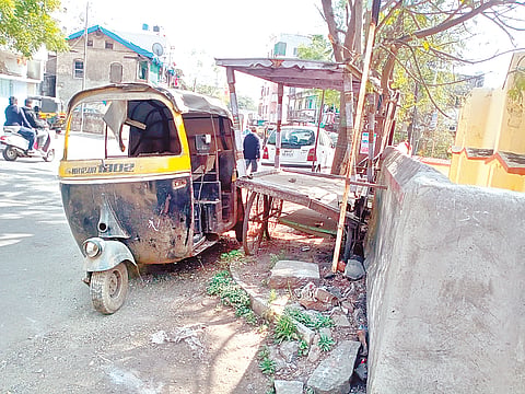 A wrecked vehicle in a state of disrepair.