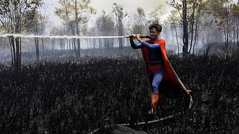 17-Year-Old Indonesian Teen Fights Wildfires in Superman Suit