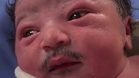 baby with mustache - AI video went viral on socail media