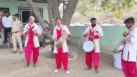 pmc play musical band in front of property tax violators houses