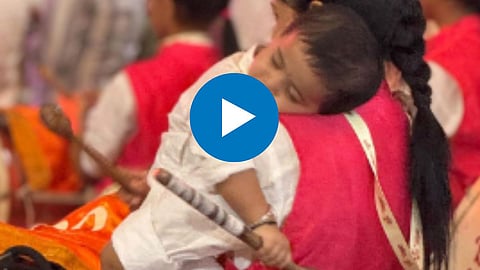 Mother playing Dhol Tasha