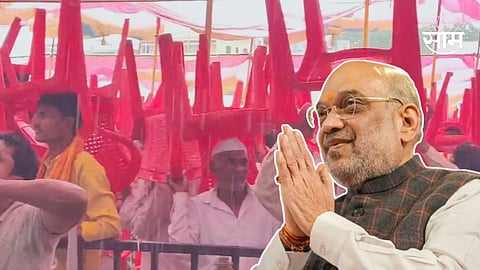 अमित शाह यांच्या सभेत पावसाची हजेरी, डोक्यावर खुर्च्या घेऊन कार्यकर्त्यांनी ऐकलं भाषण