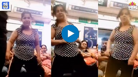 A woman seen performing an unusual dance inside a crowded metro train, as stunned commuters look on.